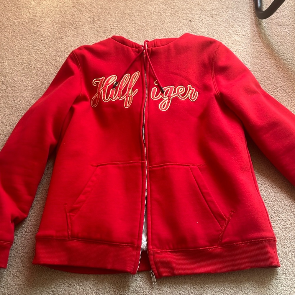 Red Tommy Hilfiger zip up fuzzy jacket. thick material, perfect for winter!